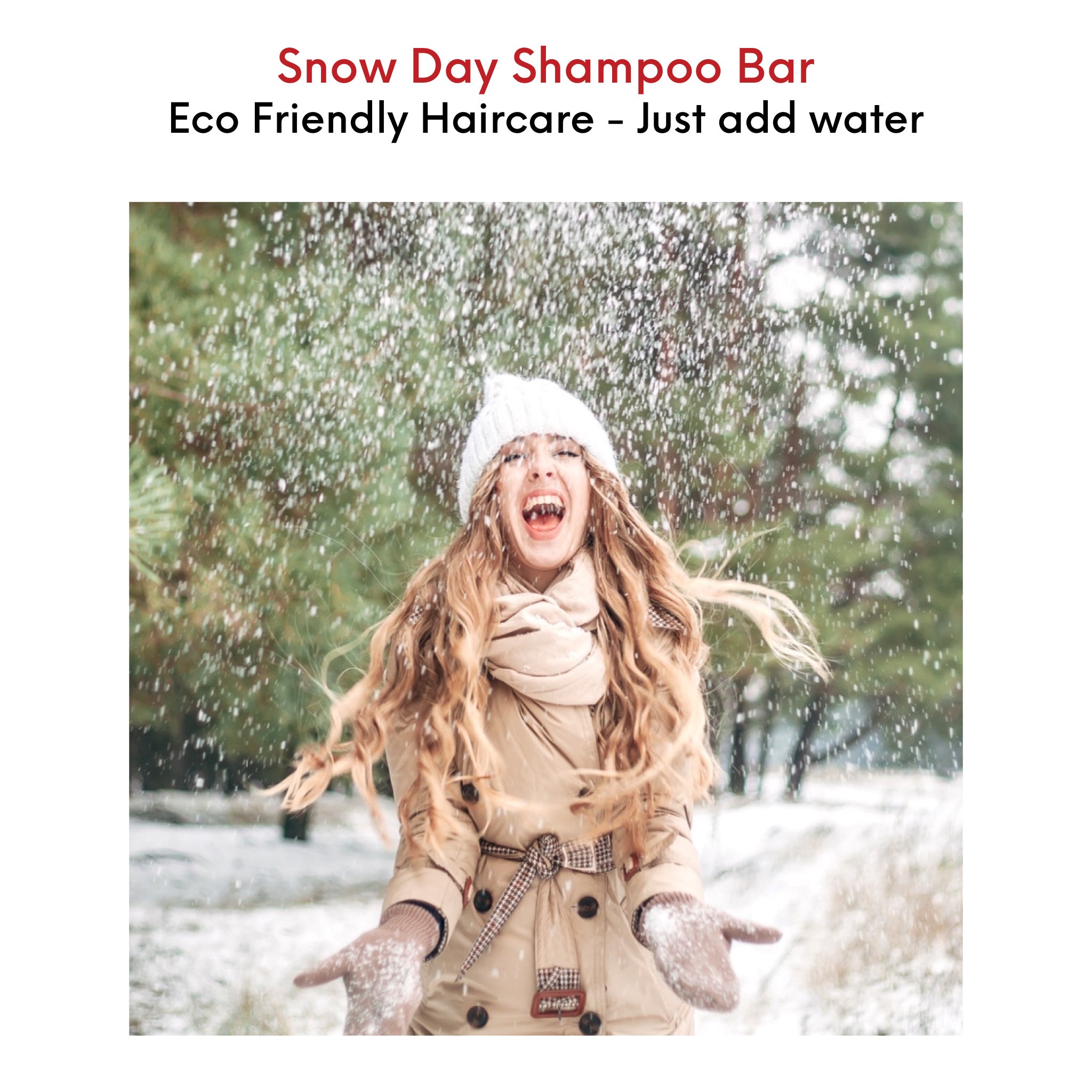 Young woman with beautiful, healthy, long, wavy hair having fun in the snow, embracing the cool outdoors.